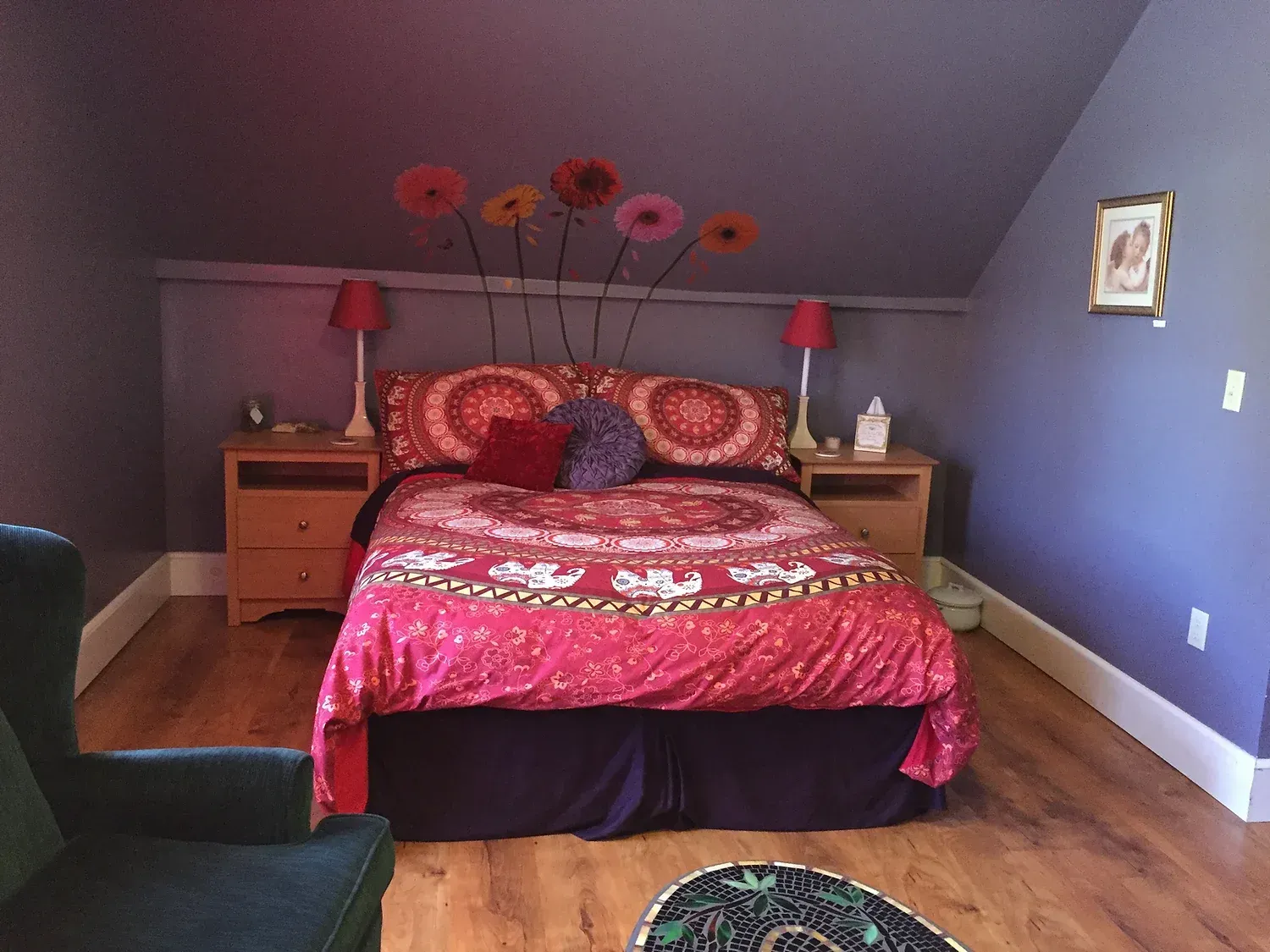 A bedroom with purple walls and a pink bed