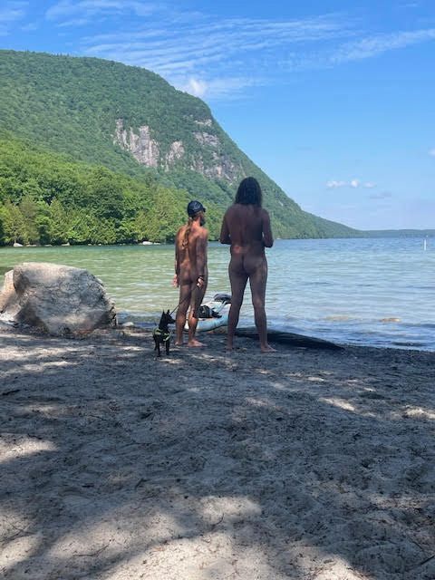 Two people on the beach at Willoughby lake