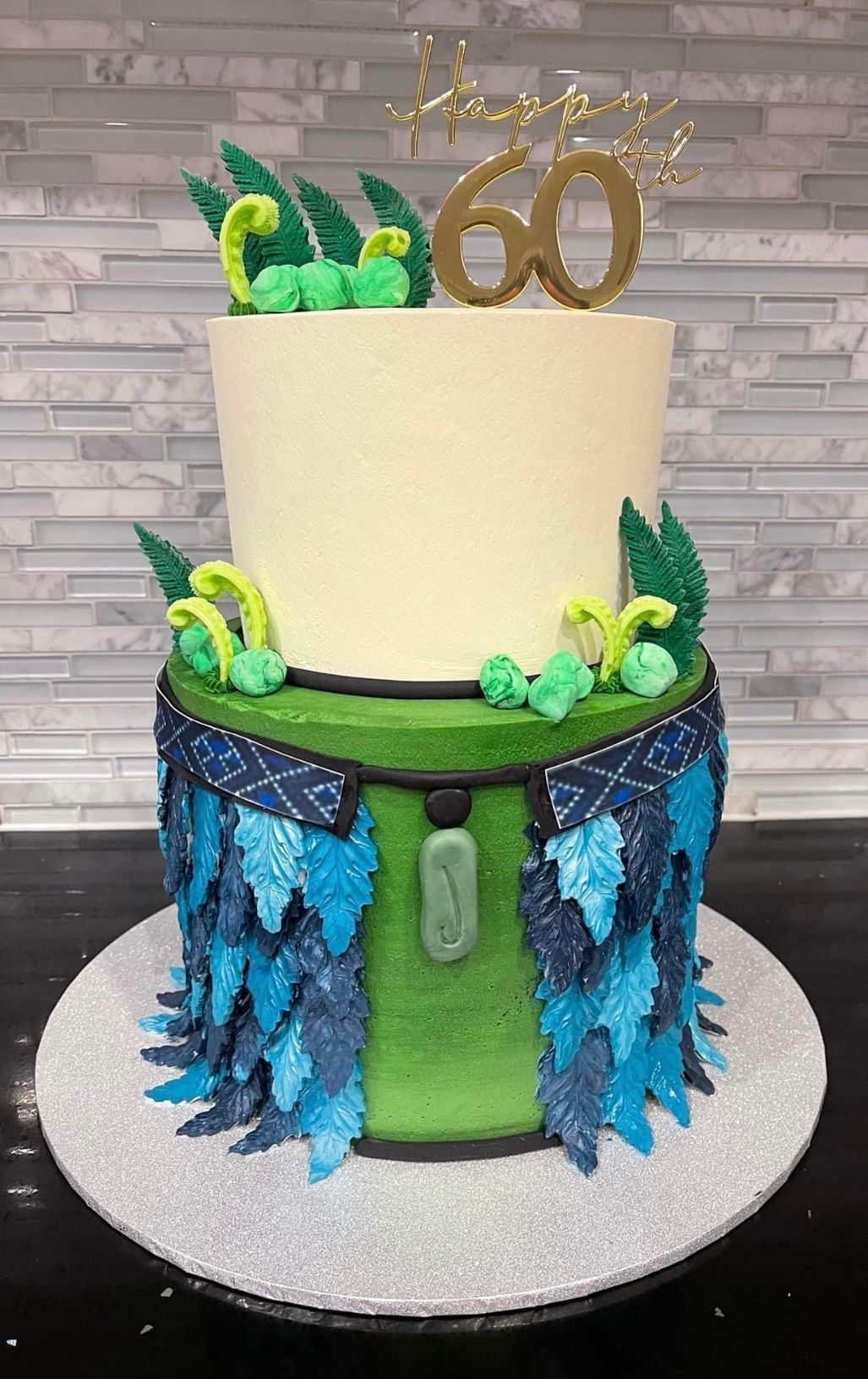 A birthday cake with a number 60 on top of it.