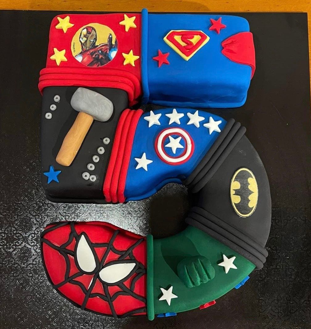 A birthday cake in the shape of the number 5