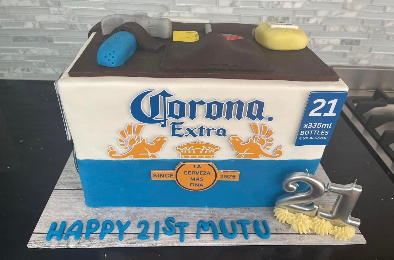 A cake that looks like a box of corona extra beer