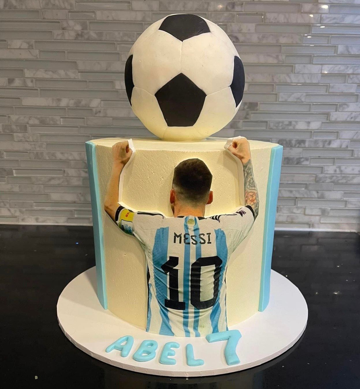 A cake with a picture of a soccer player on it