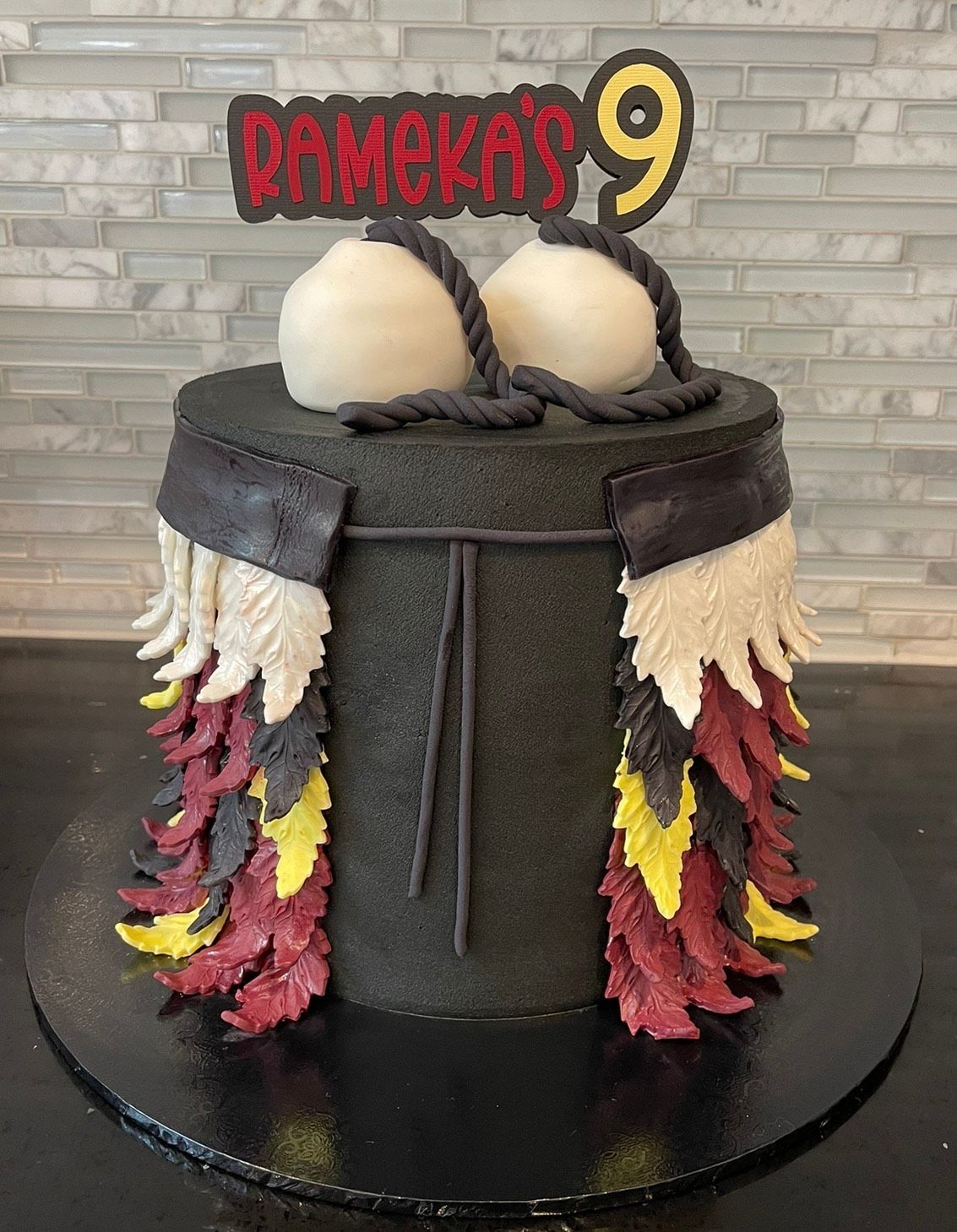 A cake with a number 9 on top of it