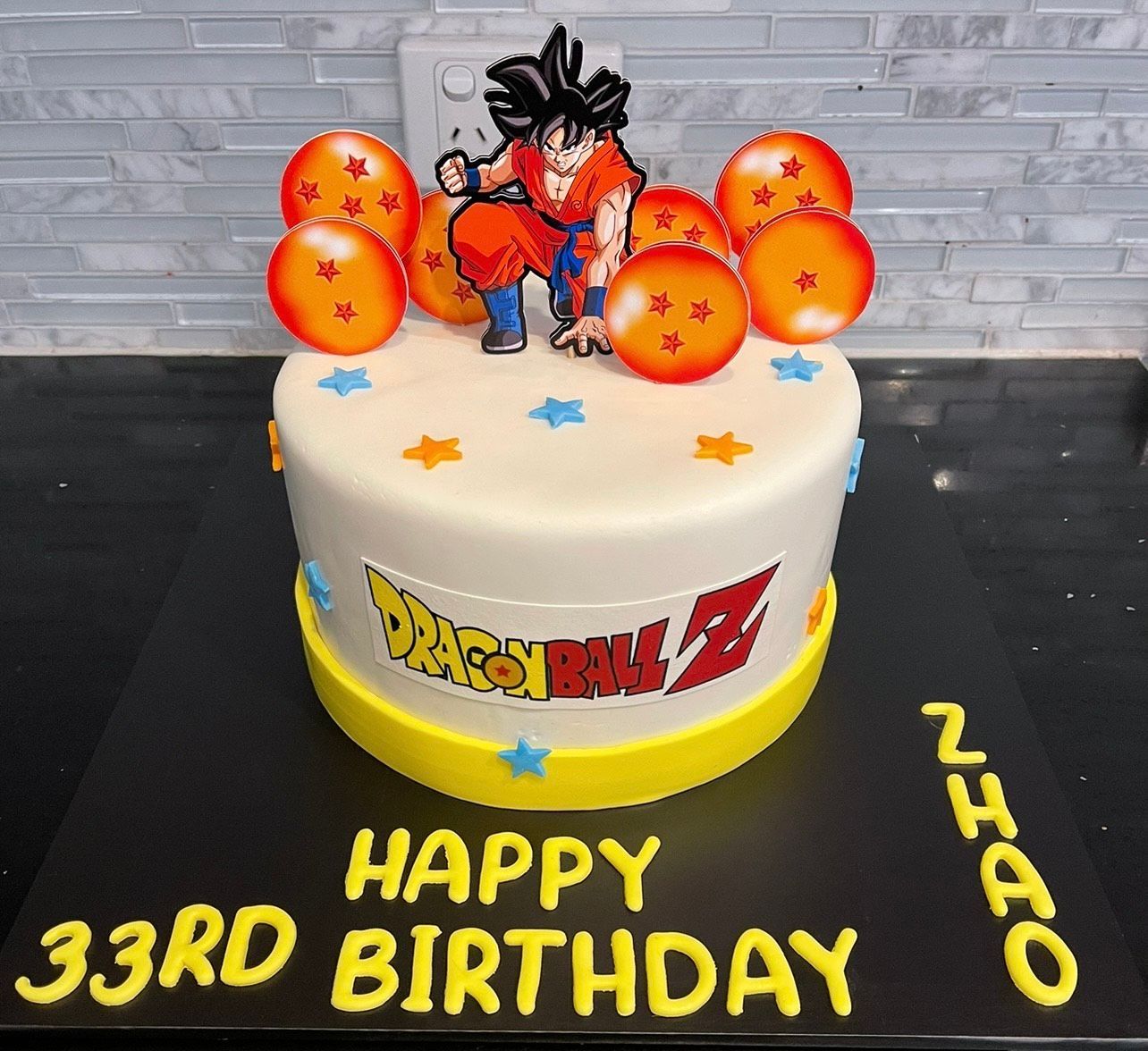 A birthday cake with a dragon ball z character on it