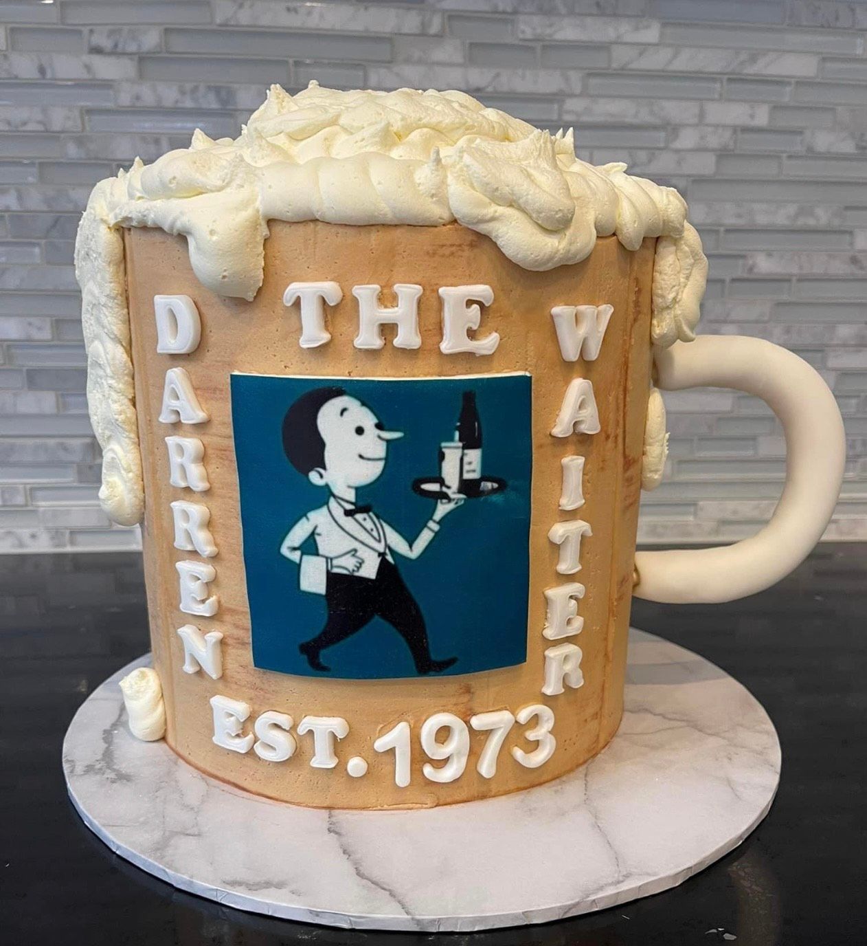 A cake in the shape of a mug that says the waiter