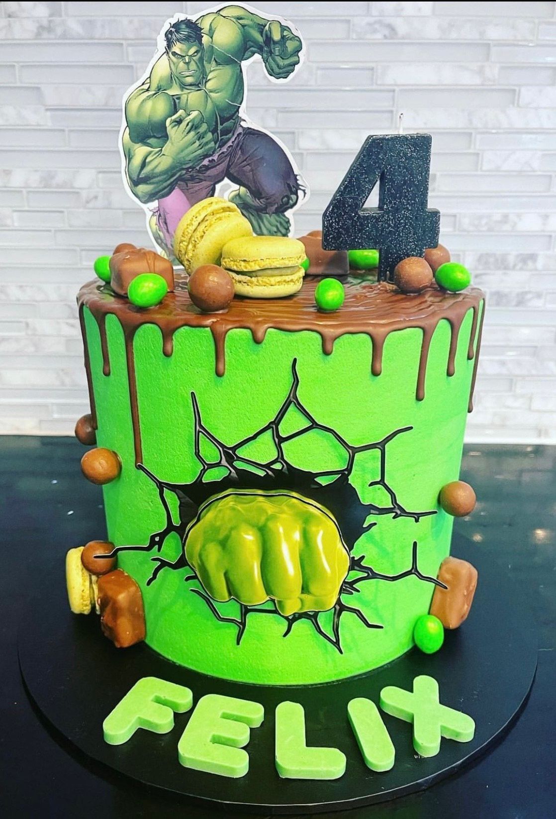 A cake with a picture of the hulk on top of it