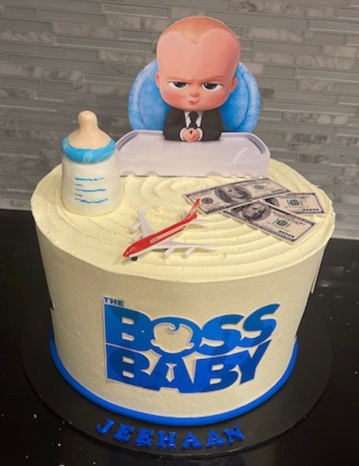 A cake that says the boss baby on it