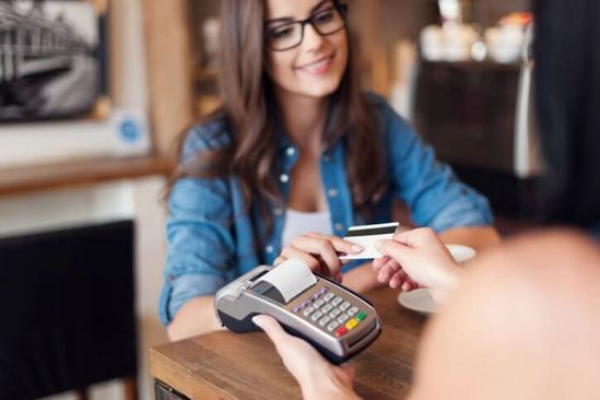 Girl handing over credit card — Family Dental Practice in Fairless Hills, PN