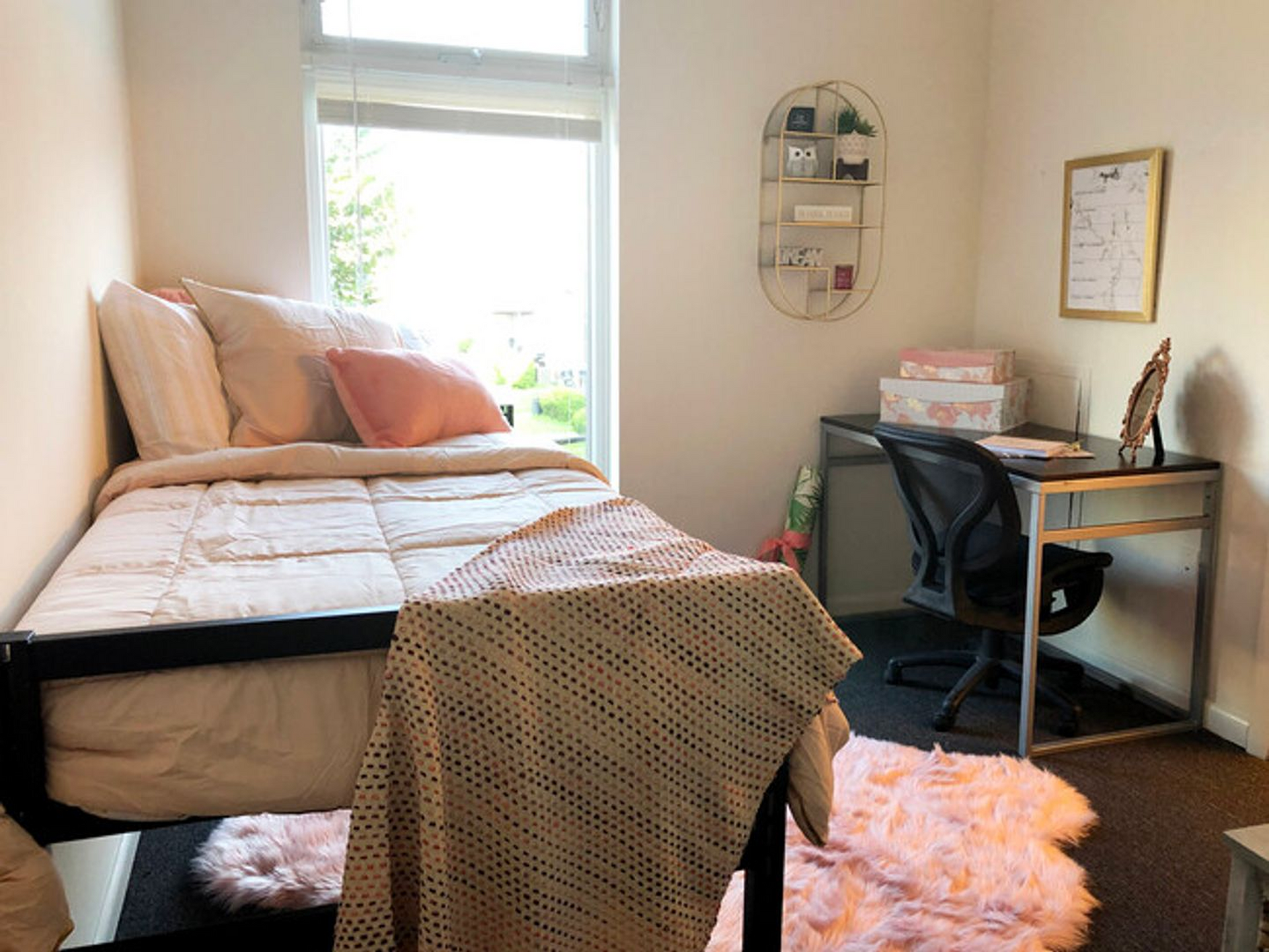 Two-bedroom apartment floor plan bedroom at Temple Crossing with desk and window view