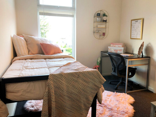 Two-bedroom apartment floor plan bedroom at Temple Crossing with desk and window view