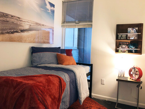 Four-bedroom apartment floor plan bedroom at Temple Crossing with cozy decor and lighting