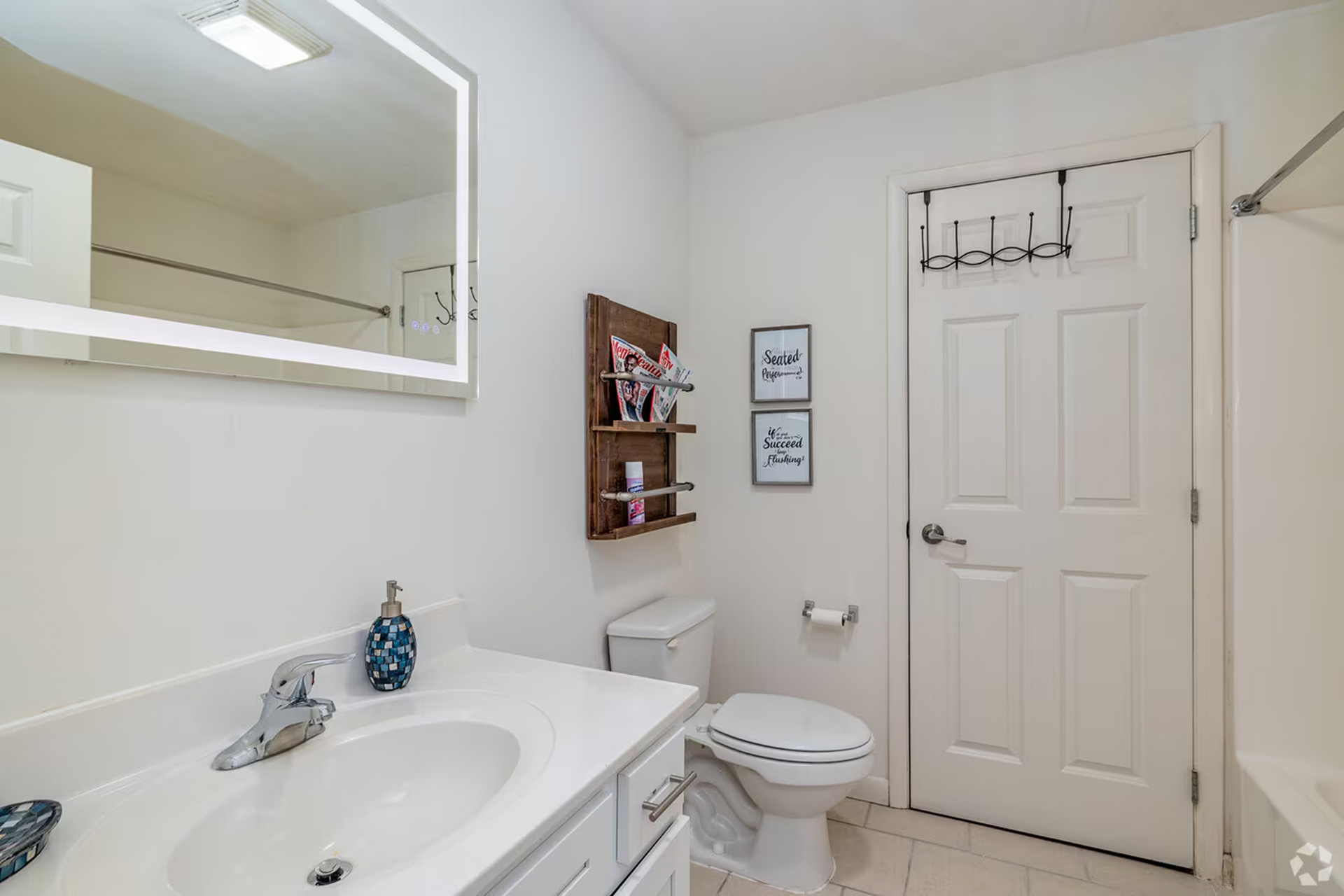 Private bathroom with vanity and storage at Temple Crossing apartments