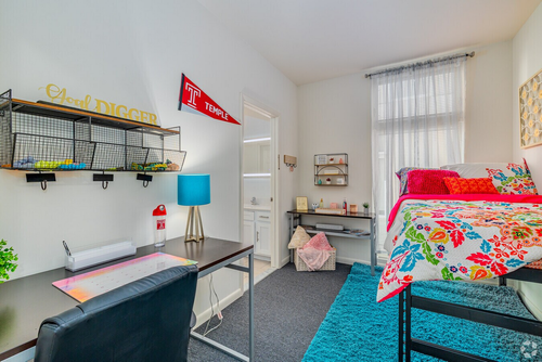 Two-bedroom apartment floor plan bedroom at Temple Crossing with desk and window view