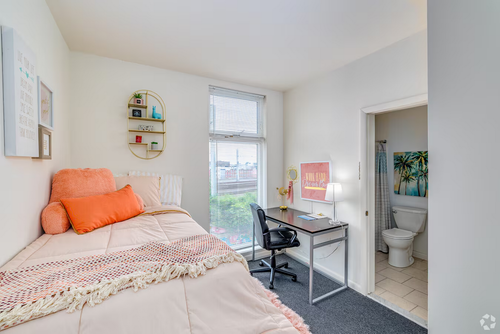 Four-bedroom apartment floor plan bedroom at Temple Crossing with cozy decor and lighting