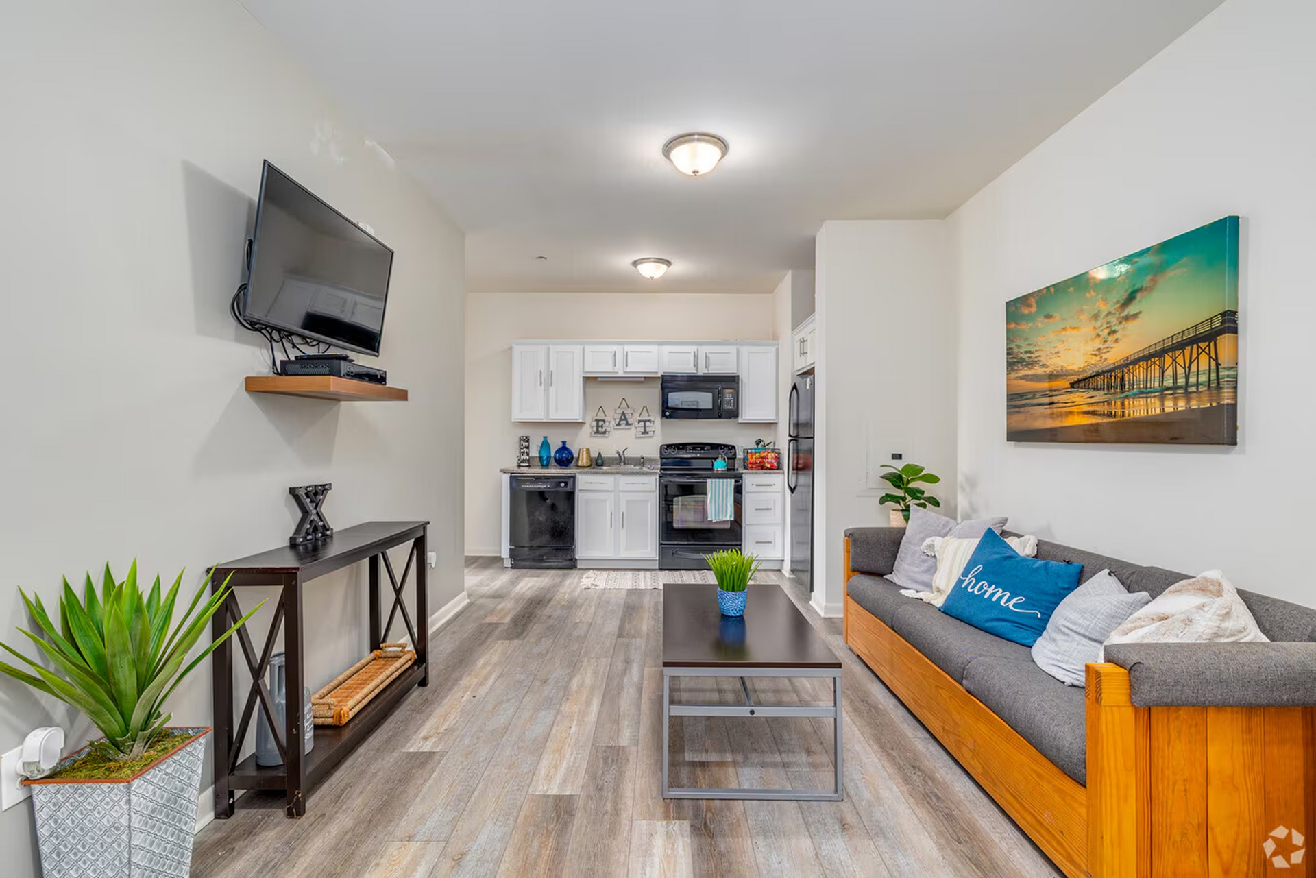 Furnished living area and kitchen in Temple Crossing apartment