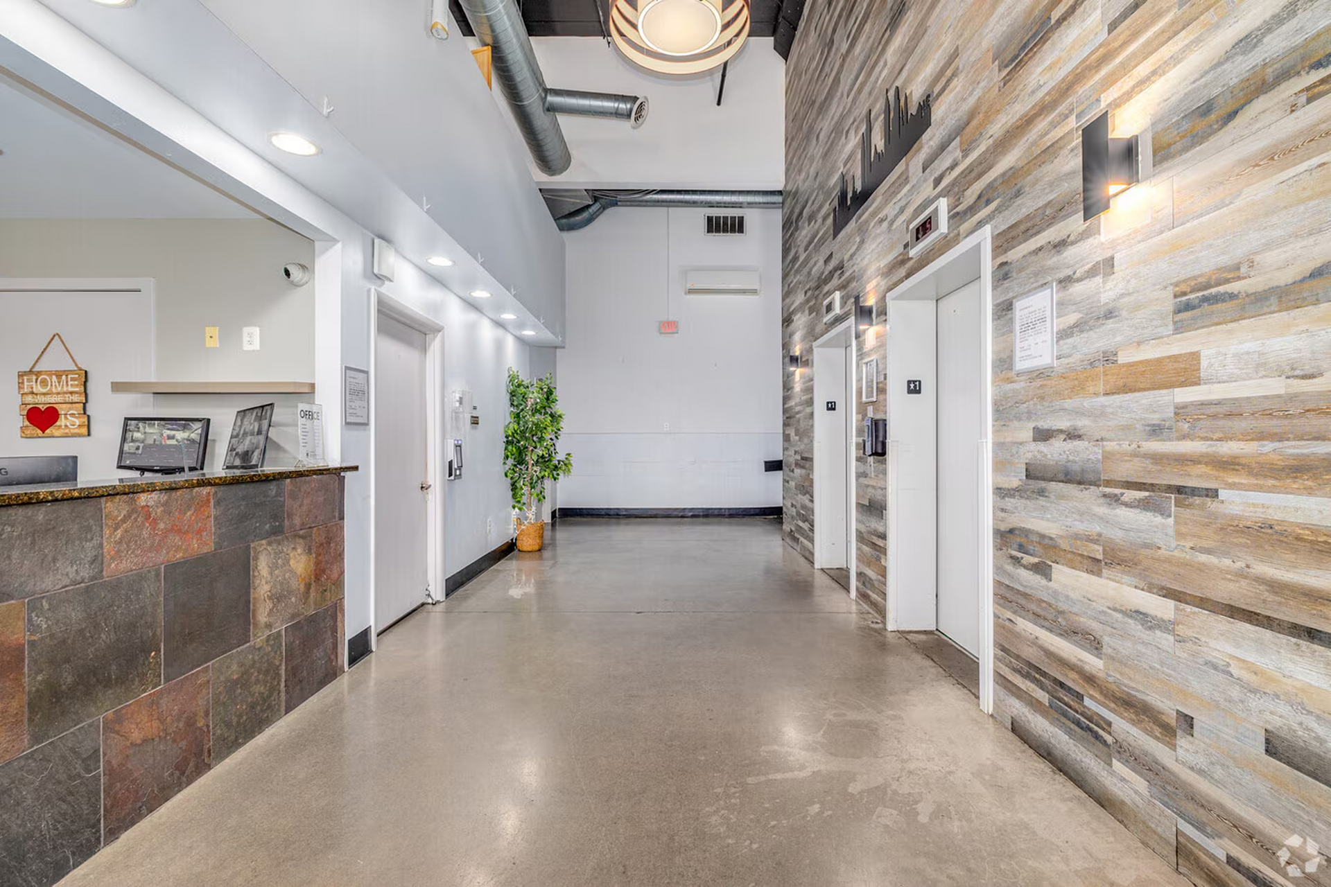 Modern lobby at Temple Crossing with wood accent walls