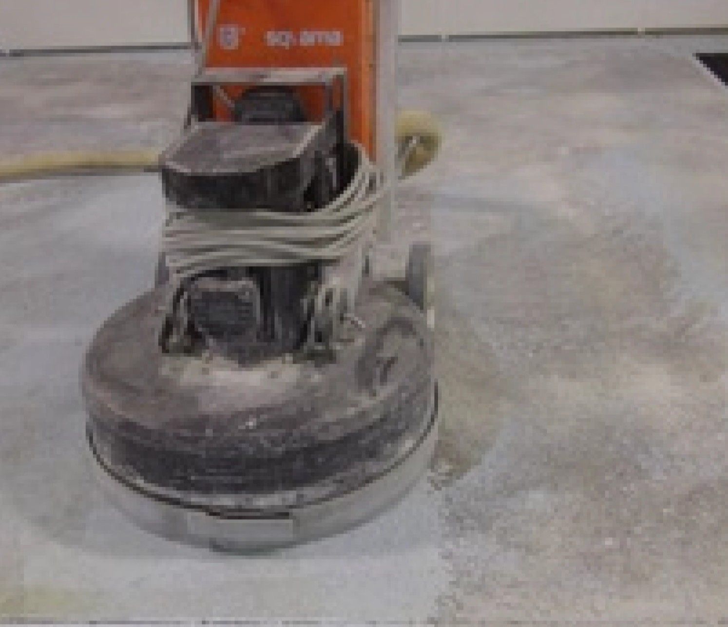 A machine is sitting on a concrete floor.