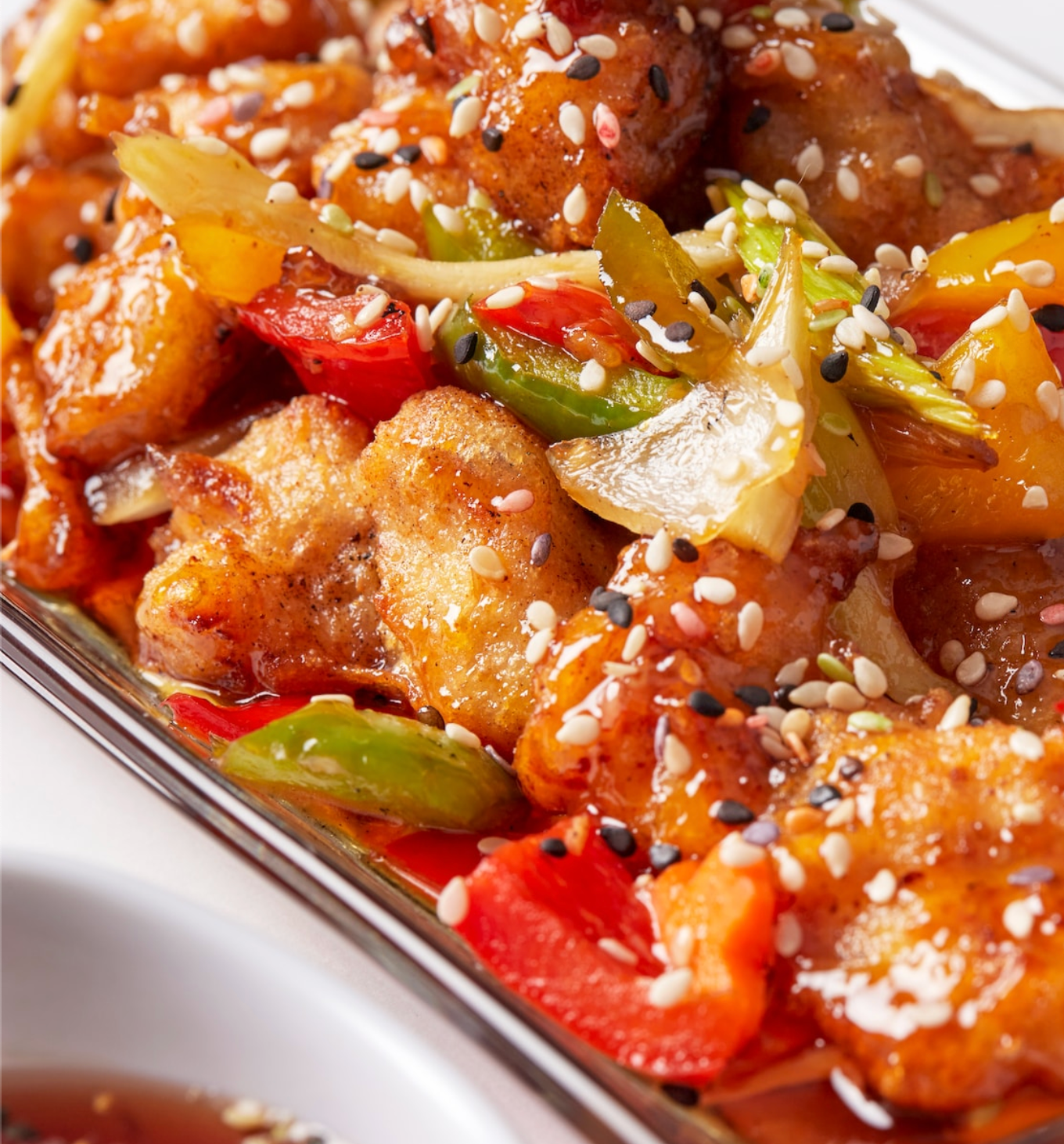 A close up of a casserole dish filled with chicken and vegetables