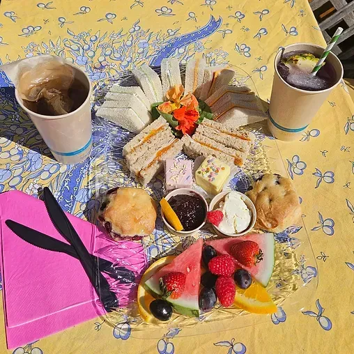 A table topped with a variety of food and drinks.