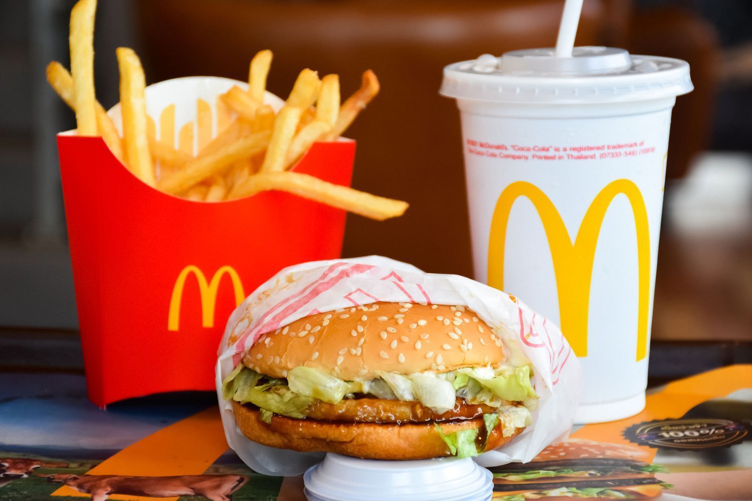 A mcdonald 's hamburger and french fries are on a table
