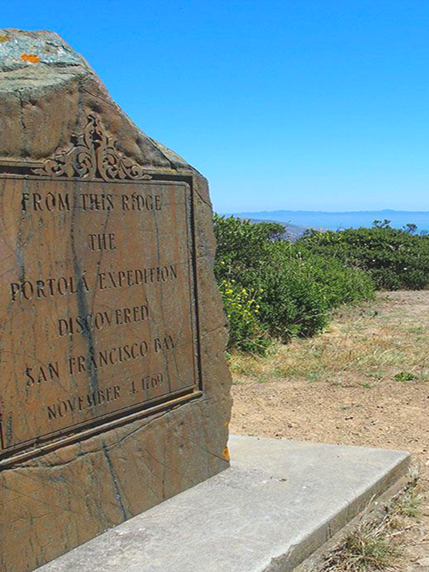 A stone plaque commemorates the discovery of san francisco bay