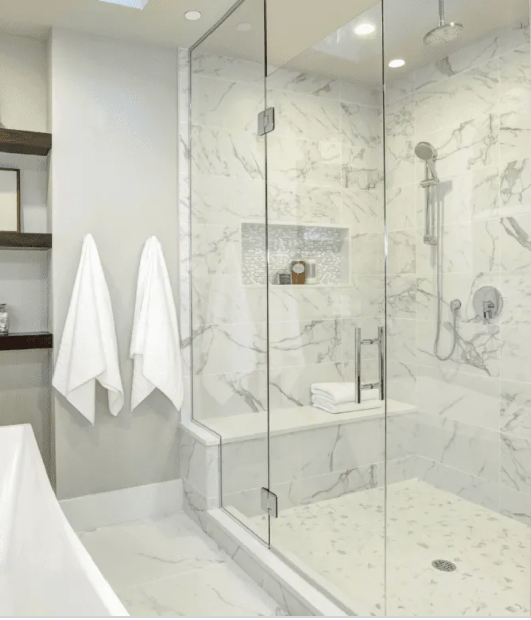 Shower with glass and van with logo. 