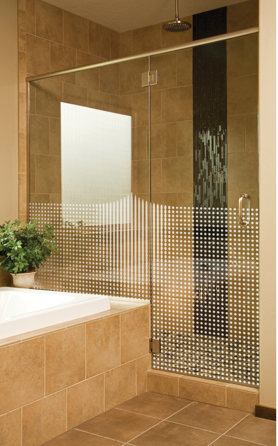Shower with grid pattern glass door, tan tile, and a built-in bathtub.