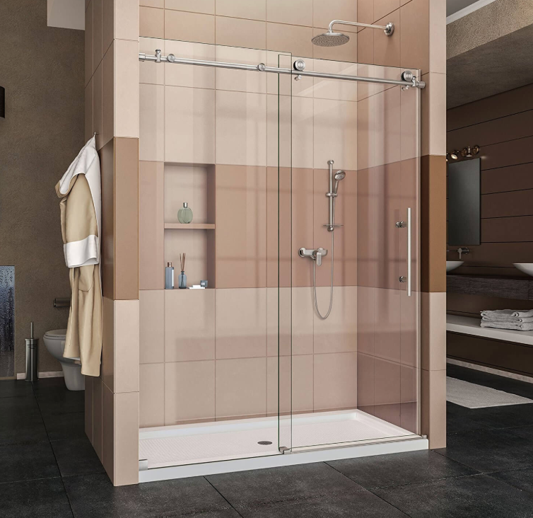 A bathroom with a sliding glass shower door