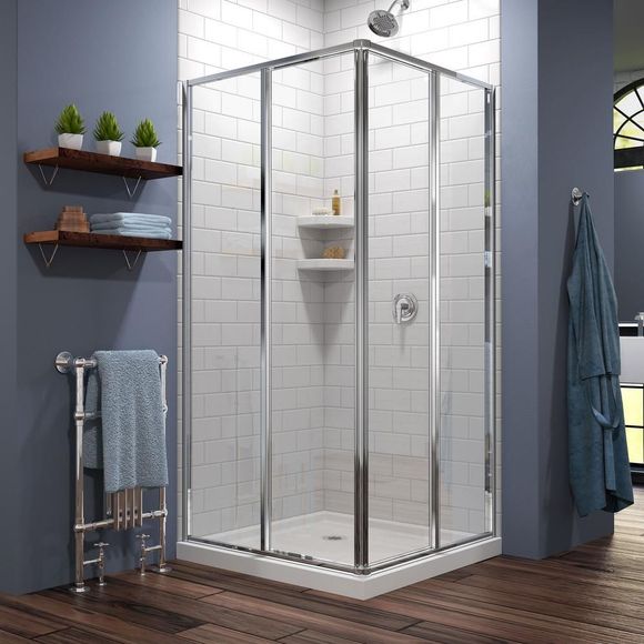 A bathroom with a shower stall and a towel rack