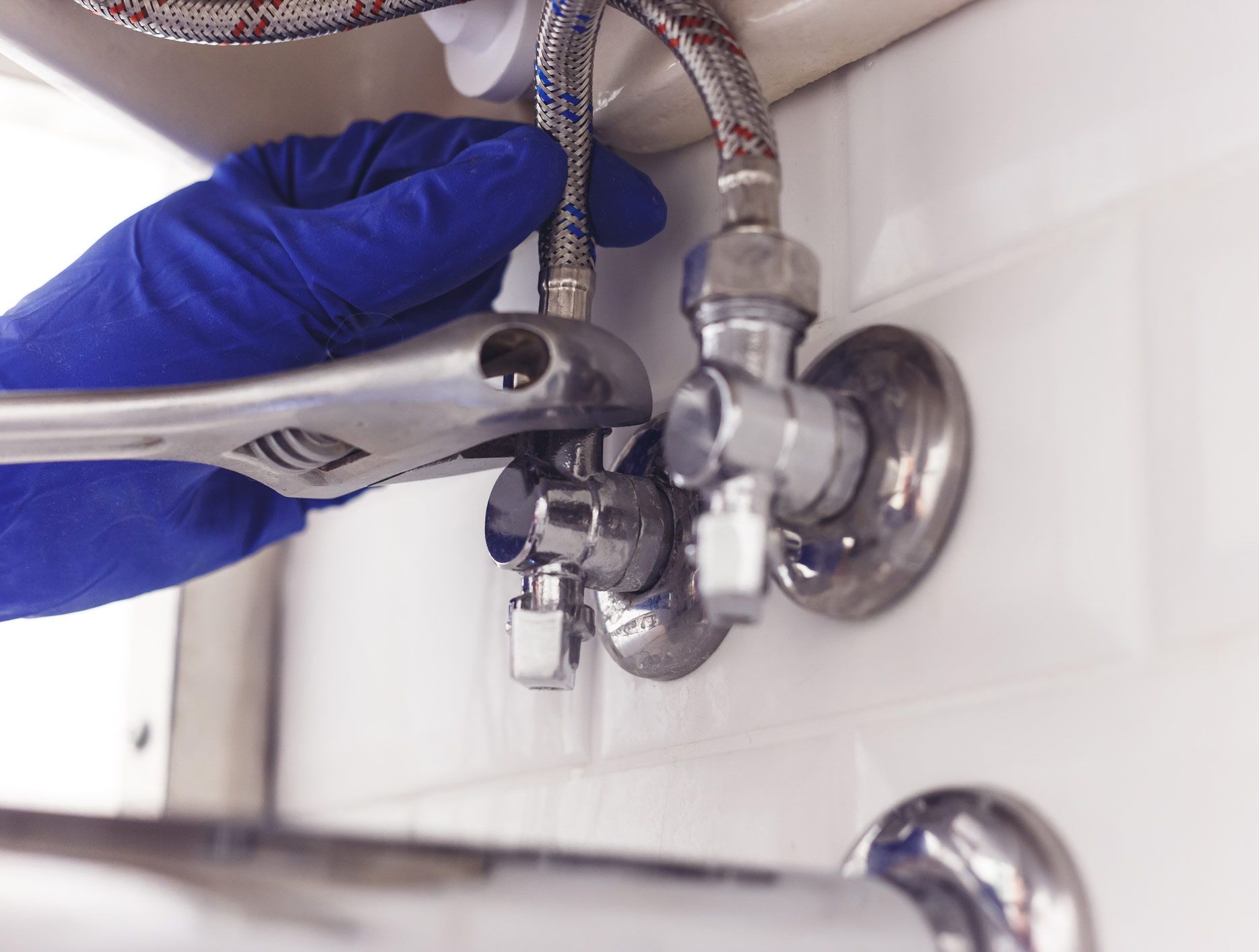 Plumber turns nut on angle valve | Cape Woolamai, VIC | South Coast Roofing and Plumbing