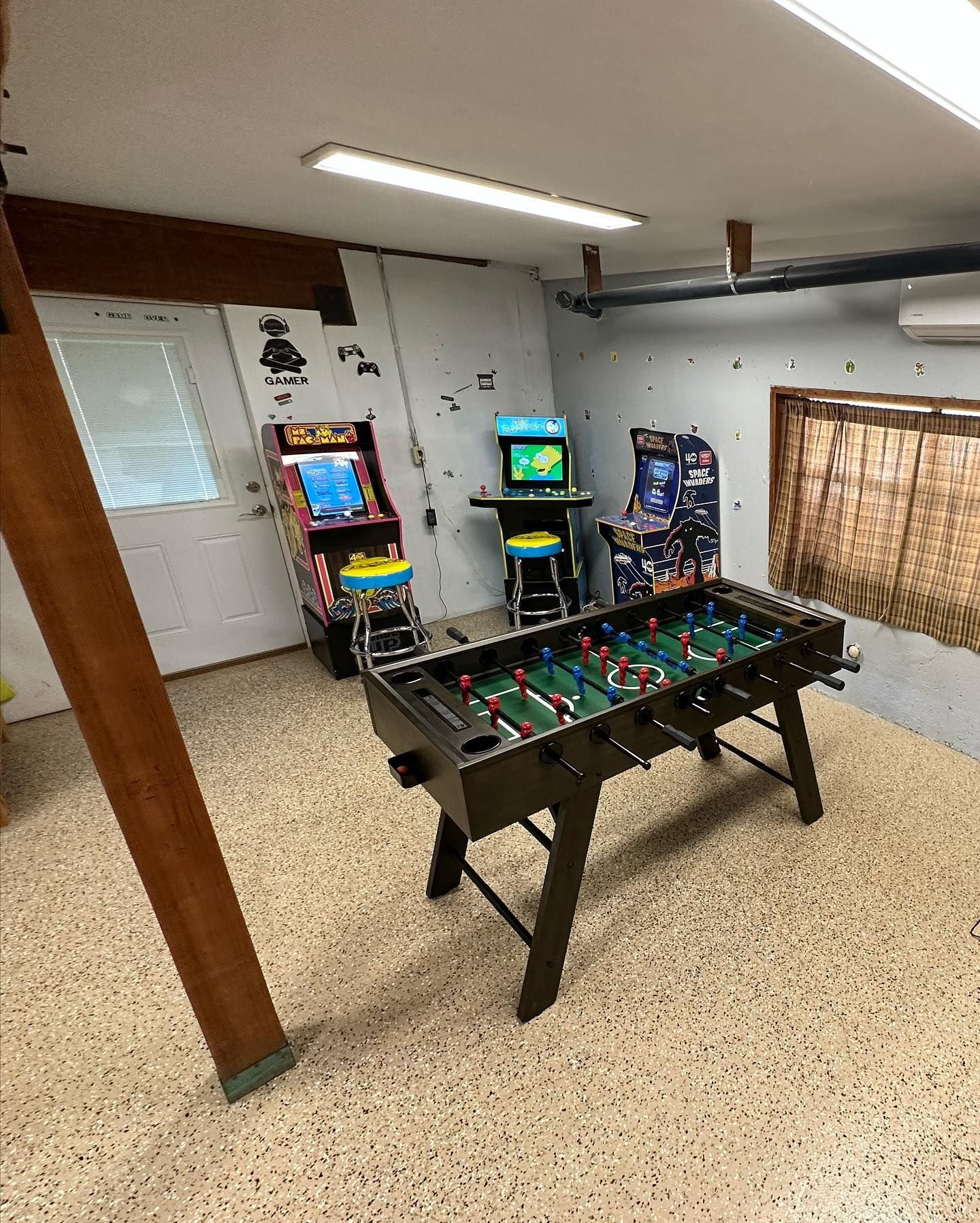 Game room with foosball and arcade games in the Italian Bar Cabin.