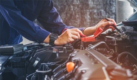 Hands of Car Mechanic — Mike's Automotive & Muffler Service in Greenwood, SC