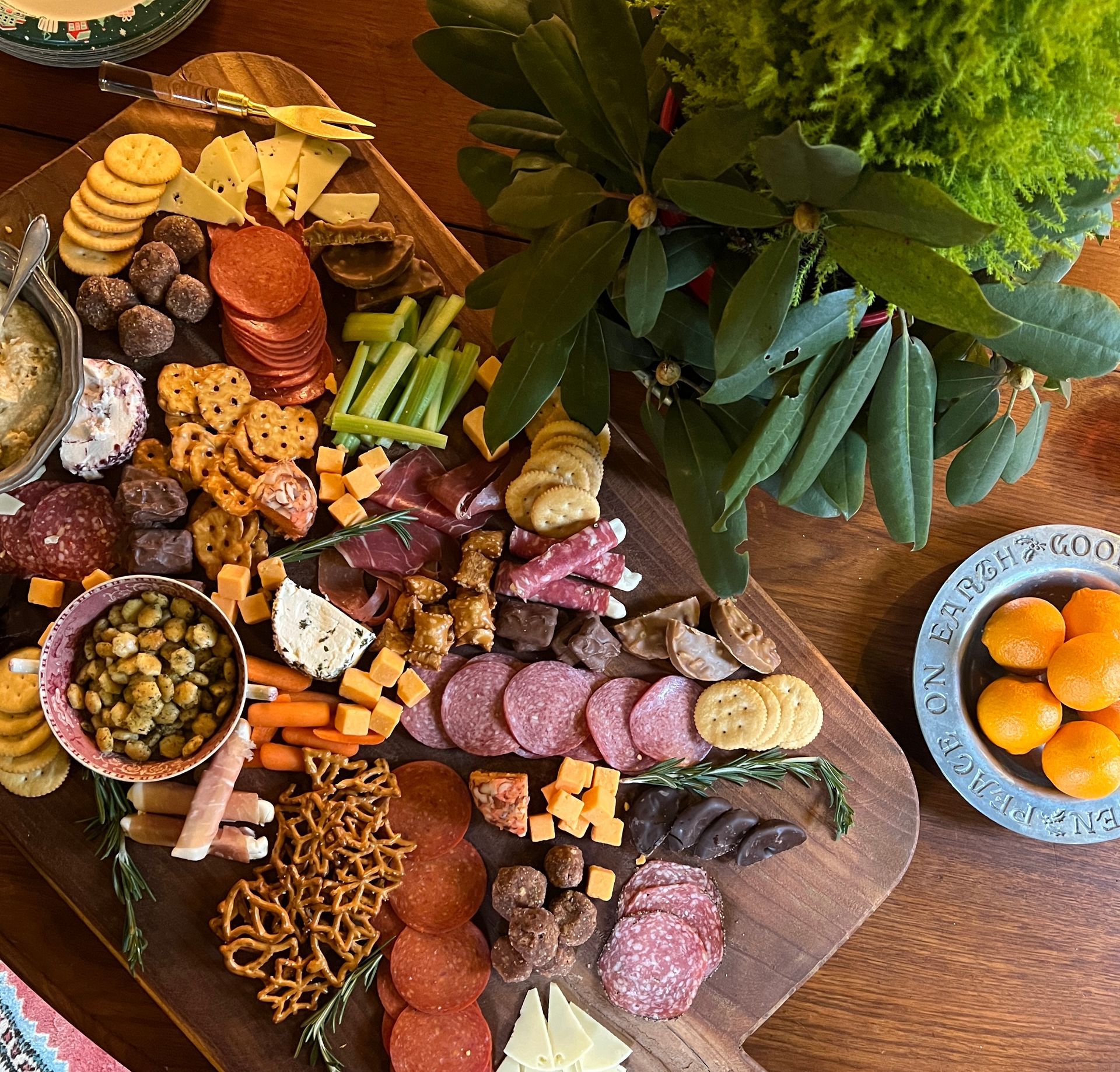 A wooden cutting board filled with lots of different types of food.