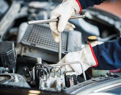 Mechanic At Work On Car Engine — Auto Repair in San Diego, CA