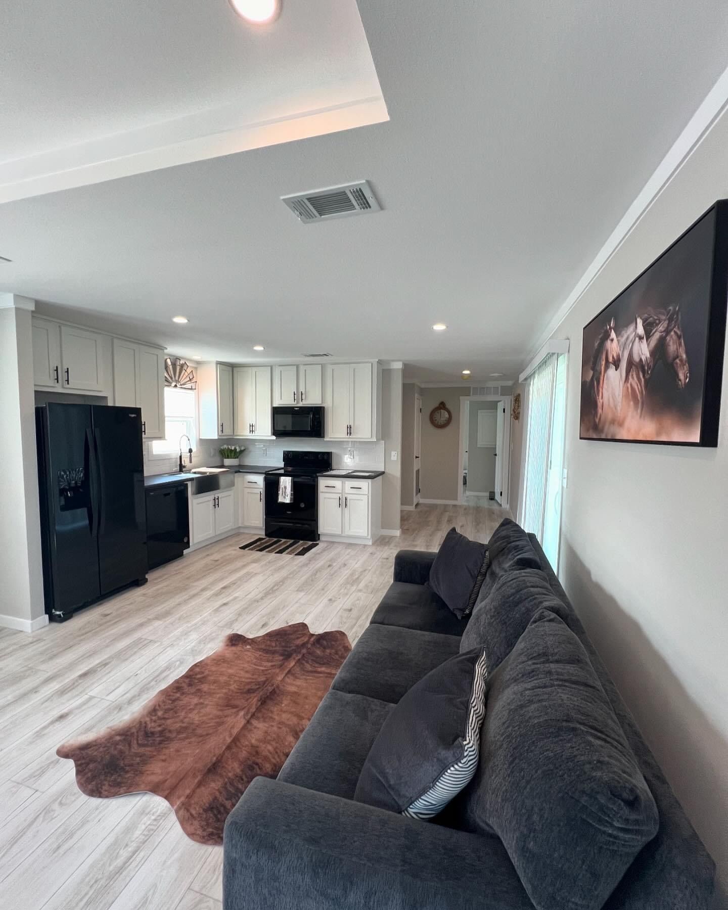 A kitchen with a staircase leading up to the second floor.