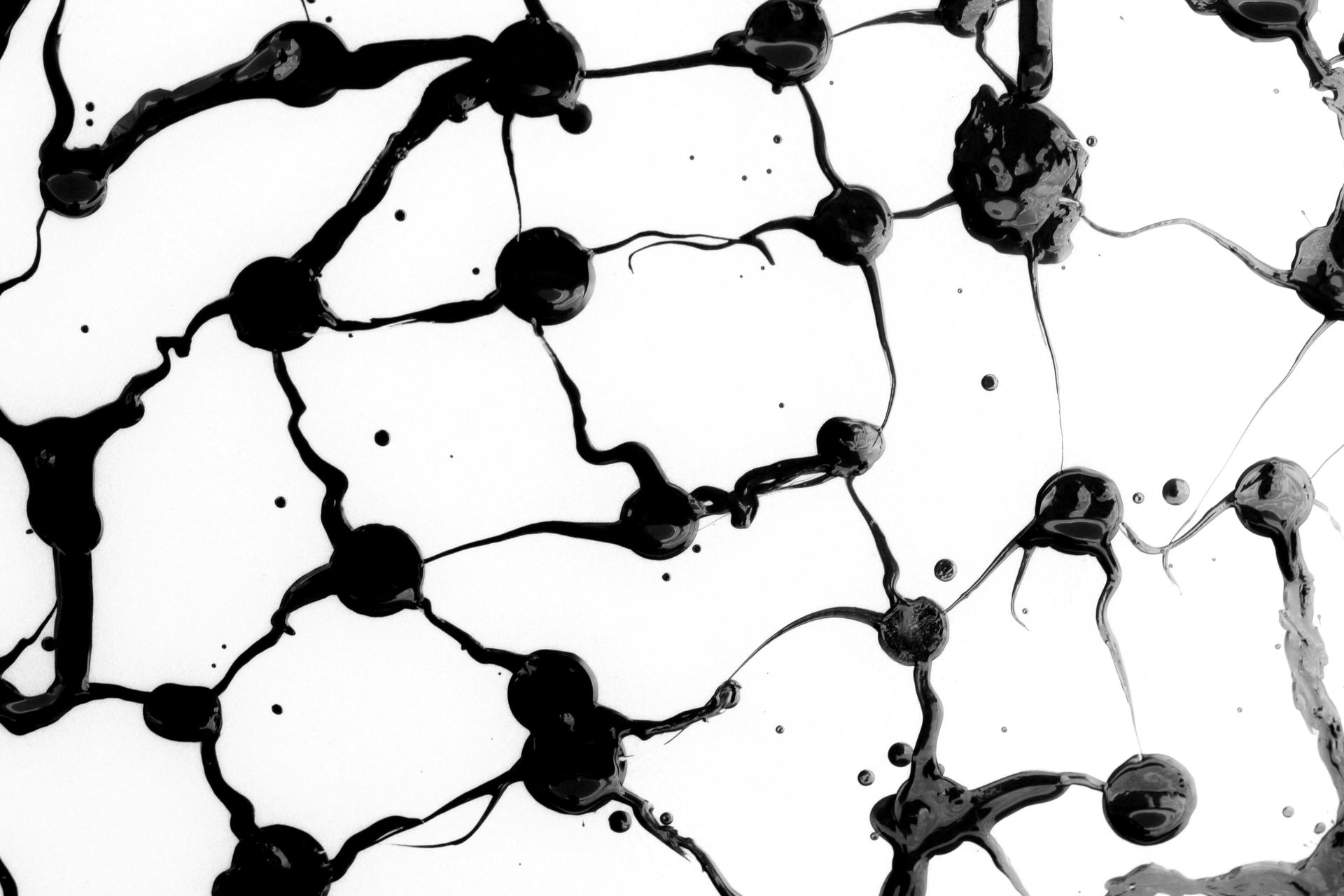A black and white image of a network of lines and dots on a white background.