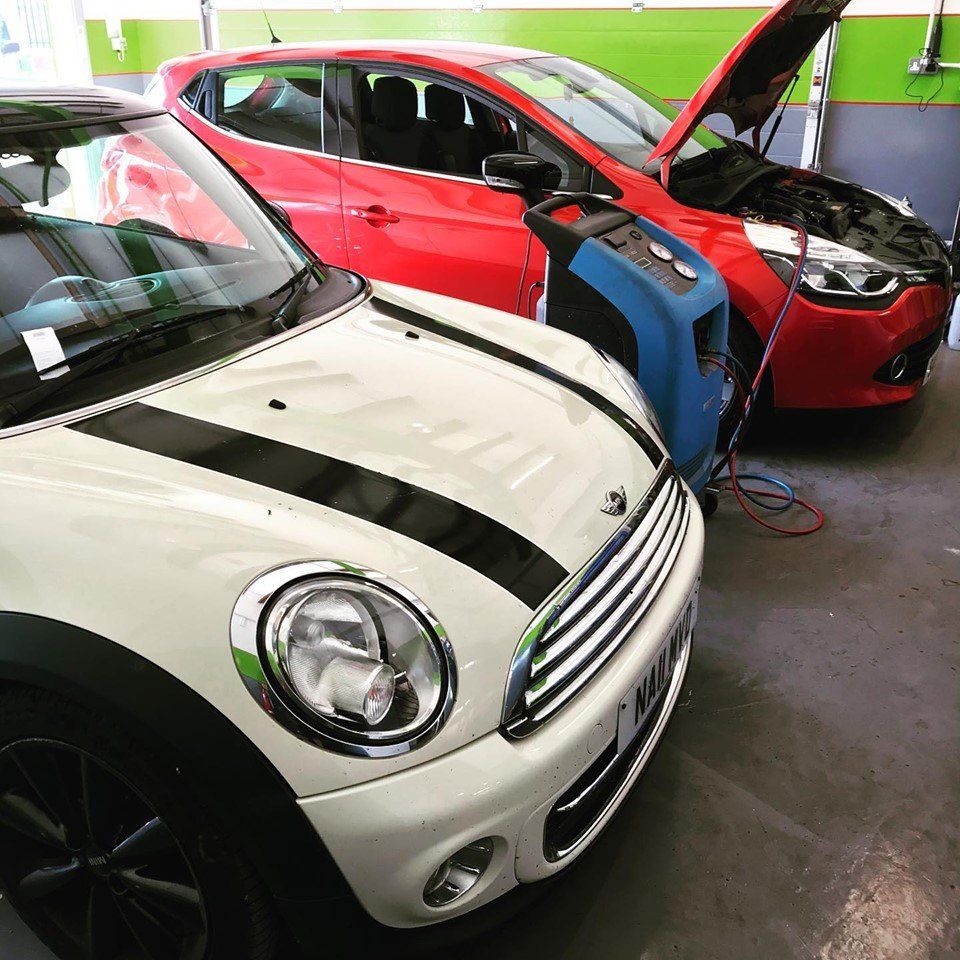 two cars getting tested