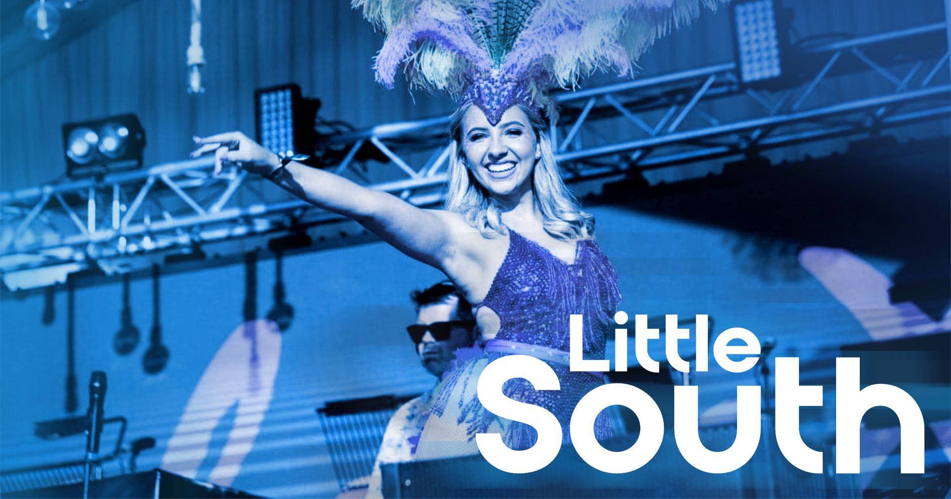 A woman in a purple dress is dancing on a stage with the words little south written on the bottom