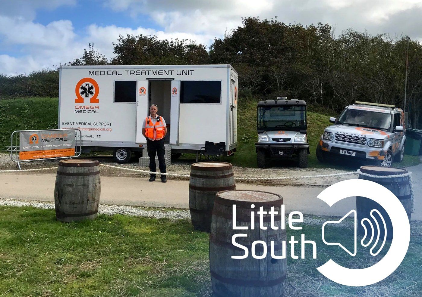 A man stands in front of a trailer that says little south