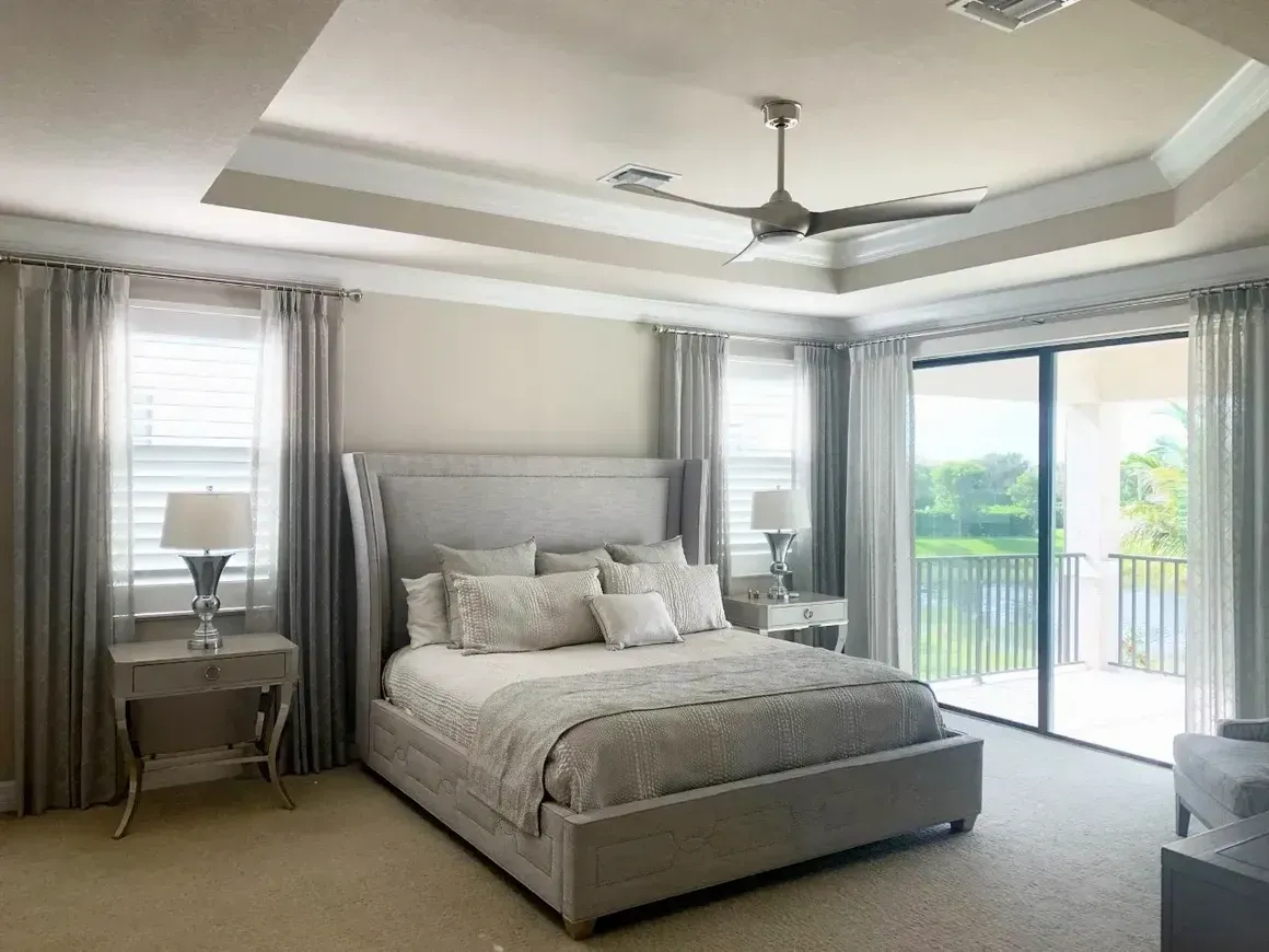 Bedroom with Big Gray and White Bed — Naples, FL — Prestige Windows & Décor