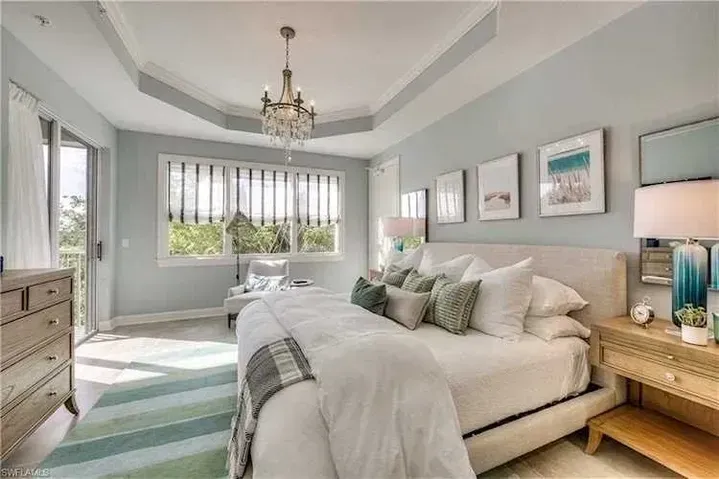 Modern Bedroom with Chandelier — Naples, FL — Prestige Windows & Décor 