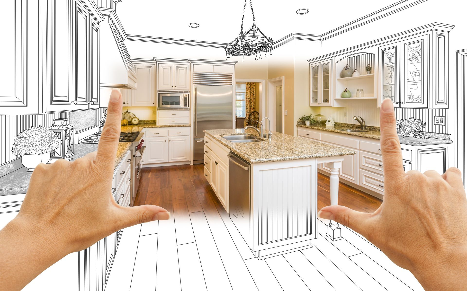Hands framing a kitchen sketch, revealing a completed kitchen with island, cabinets, and appliances.
