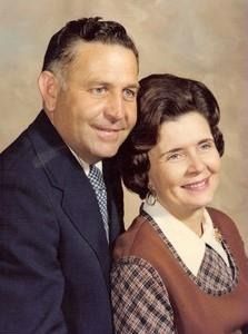 A close up of a bunch of flowers with a dark background.