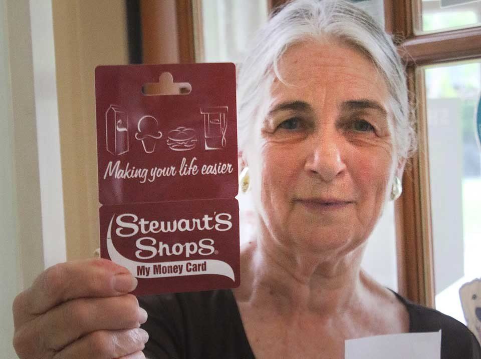 Woman Holding a Card — Arkville, NY — Titan Drilling Corp.