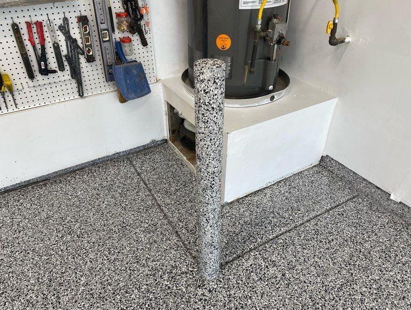 There is a water heater in the corner of the garage.