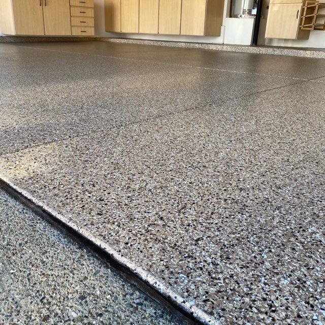 A close up of a concrete floor in a garage