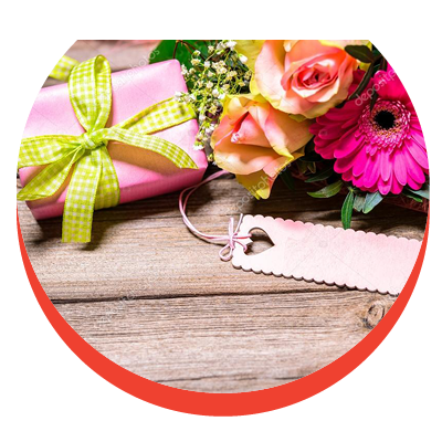 Small pink gift package with bow and flowers