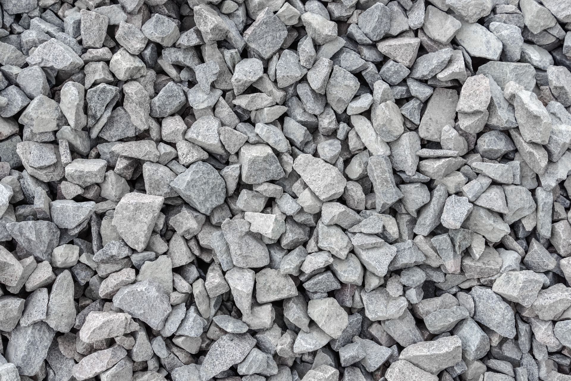 A pile of gravel is sitting on the ground.