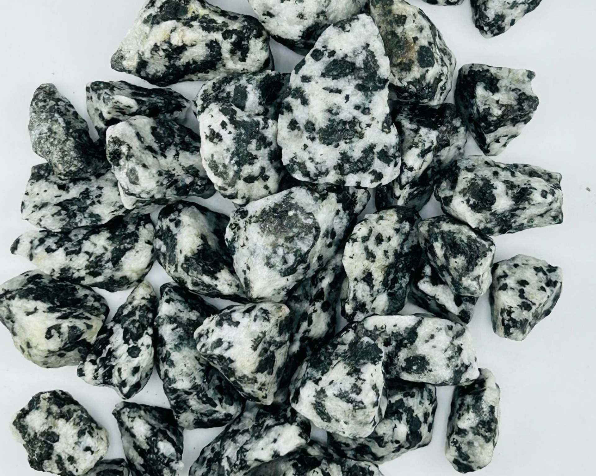 A pile of green and brown rocks on a table.