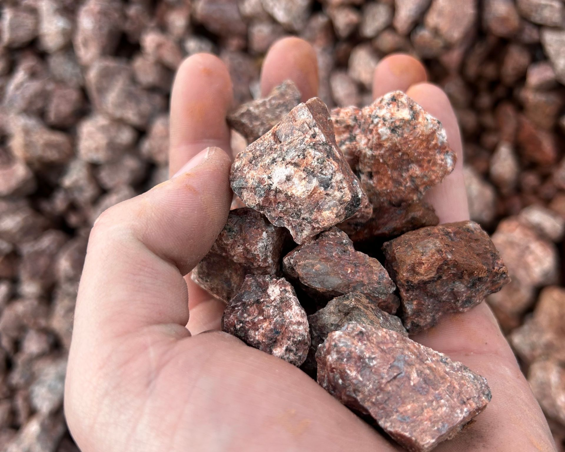A pile of gravel is sitting on the ground.